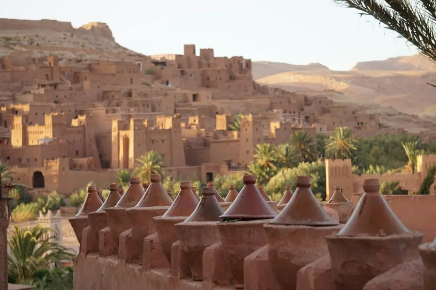 Clay tagine cooking vessels displayed above the ksar of Ait Ben Haddou