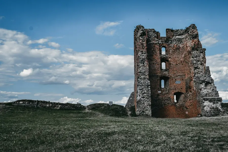 Ruined brick tower on a green hill