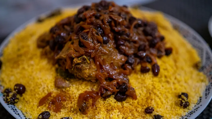 Traditional Moroccan couscous dish with tender meat and caramelized tfaya