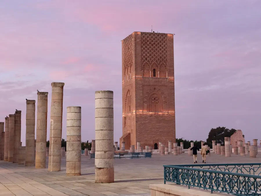 Tour Hassan minaret and ancient stone columns at dusk in Rabat