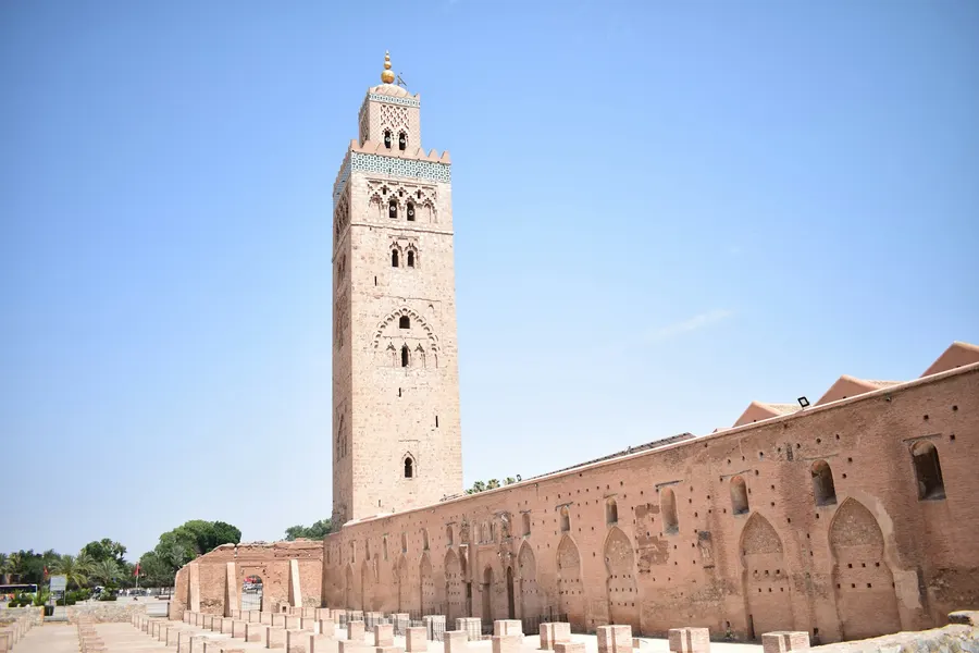 Koutoubia Mosque minaret and ancient prayer hall ruins in Marrakech