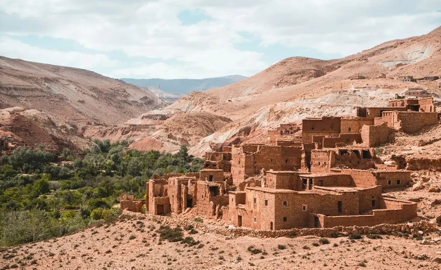 Earthen kasbah dwellings on a rocky hillside in the High Atlas