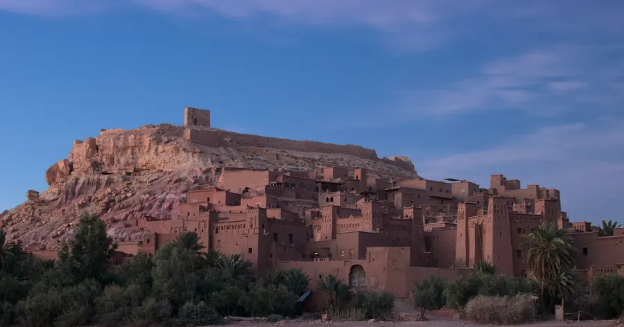 Ait Ben Haddou fortified ksar at dusk with its hilltop granary