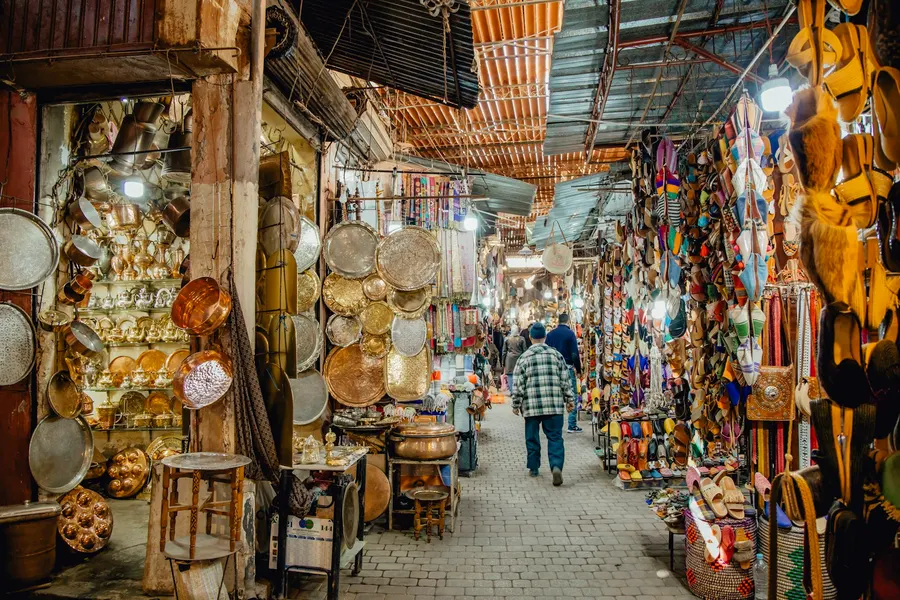 Artisan copper lanterns and leather babouche slippers in Marrakech souk