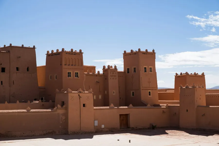 Fortified mudbrick ksar of Ait Ben Haddou against a deep blue sky