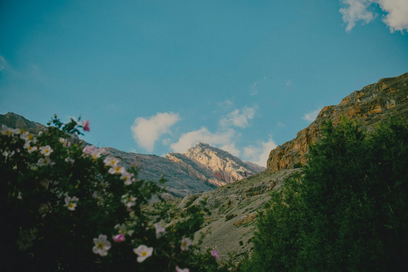 Sunlight illuminating a rugged mountain peak in the High Atlas Mountains