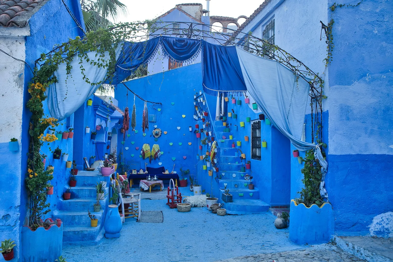 Chefchaouen nestled in the valley between the rocky peaks of the Rif mountains