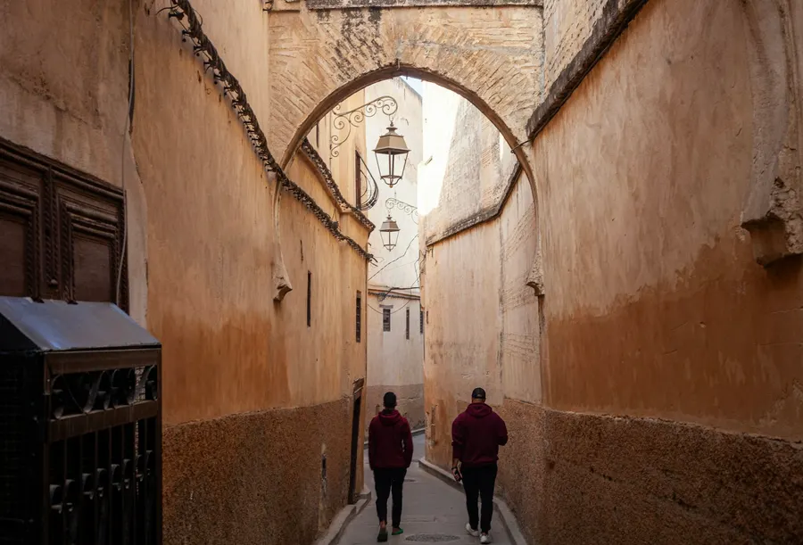 Leather tanners at the historic Chouara Tannery dye vats in Fes el-Bali